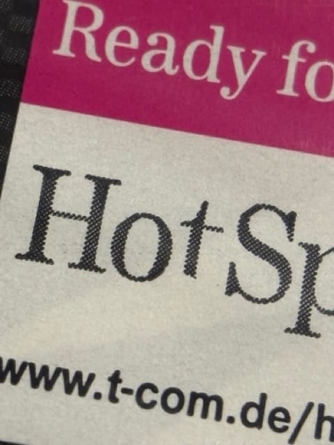 Nintendo Wi-Fi and Hotspot sticker comparison showing reproduction differences